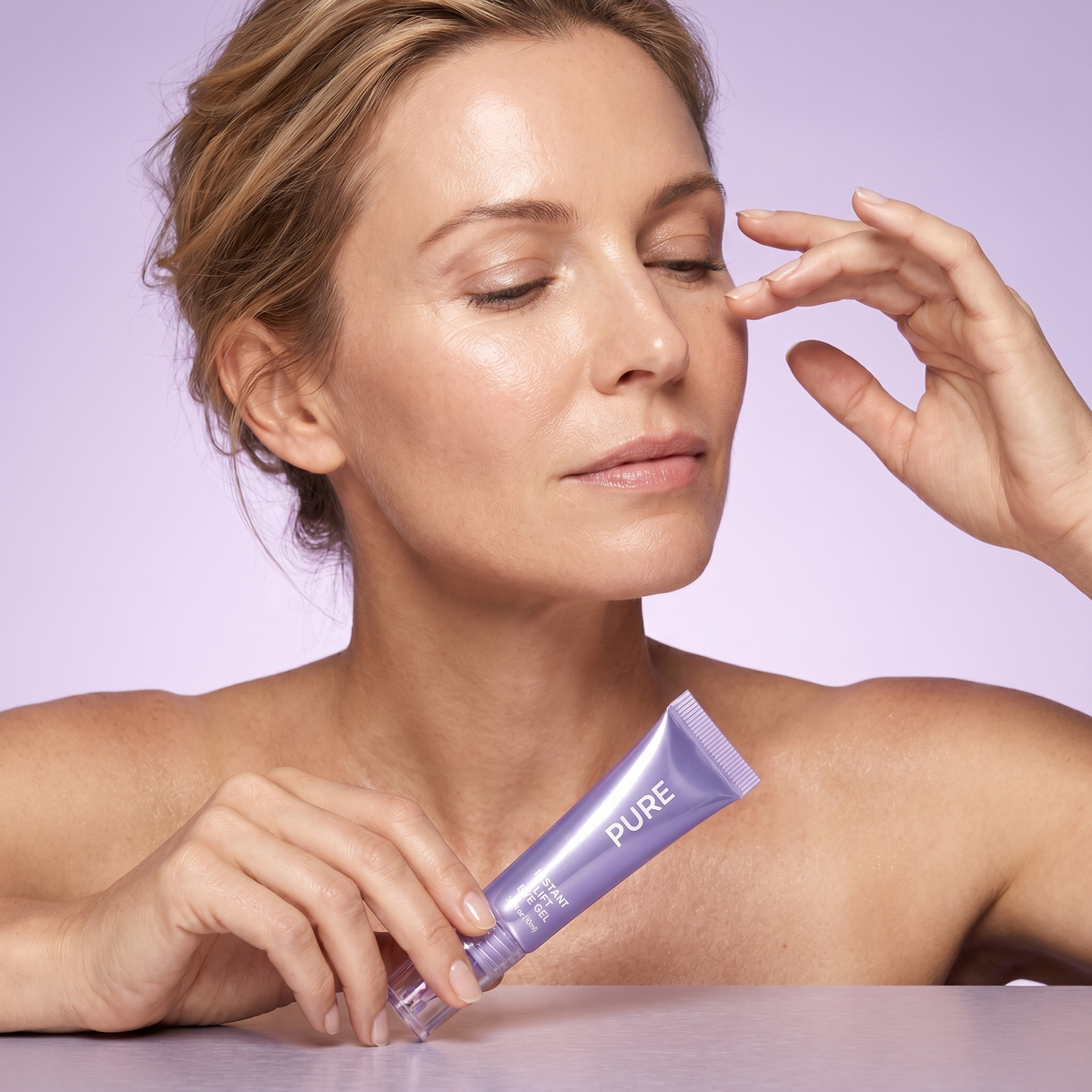 Woman applying skincare product